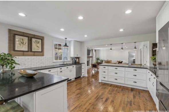 Warm wood-look flooring installation in kitchen by AVS Flooring